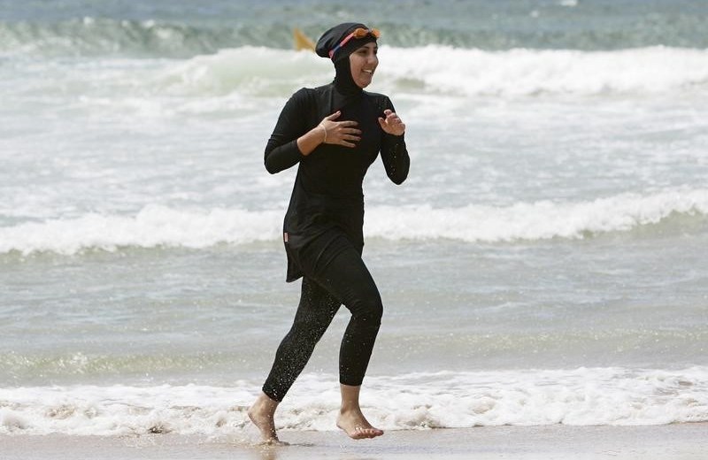 Trainee volunteer surf life saver Laalaa runs along North Cronulla Beach in Sydney